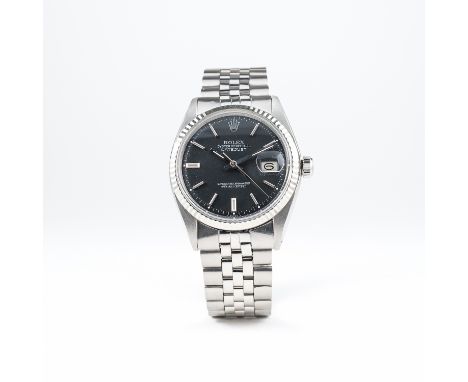 A GENTLEMAN'S STEEL &amp; WHITE GOLD ROLEX OYSTER PERPETUAL DATEJUST BRACELET WATCH CIRCA 1969, REF. 1601 
D: Matte black dia
