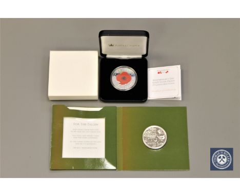 A 2016 Remembrance Day silver proof 1oz £5 coin by The Jubilee Mint, a limited edition of 999, boxed with certificate, togeth