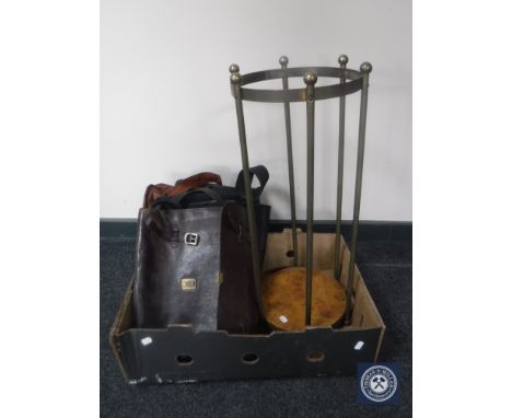 A cylindrical brass stick stand with four assorted leather satchels 