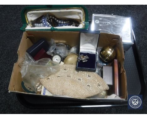 A tray of costume jewellery, silver fob watch, beaded purse, compact, china dolls, cars, table lighter etc 