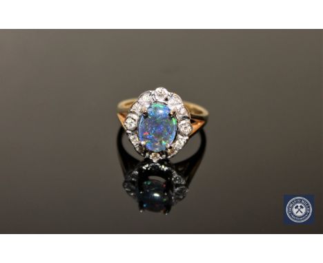 An 18ct gold triplet opal and diamond cluster ring, size O