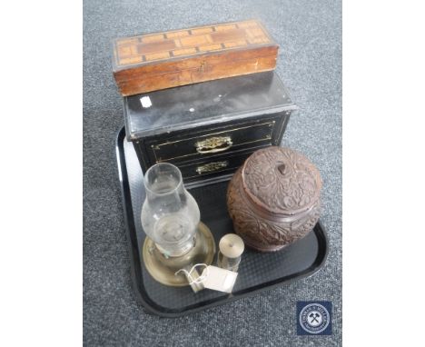 A tray of a carved hardwood lidded pot, brass oil lamp with glass chimneys, miniature brass miner's lamp, Victorian cribbage 