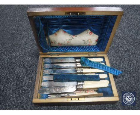 A Victorian mahogany box containing a six-place knife and fork service 