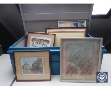 An early 20th century tin trunk containing pictures, needlework and prints 