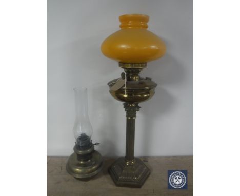 A Victorian Duplex brass Corinthian column oil lamp with orange glass shade plus a further oil lamp with glass chimney 