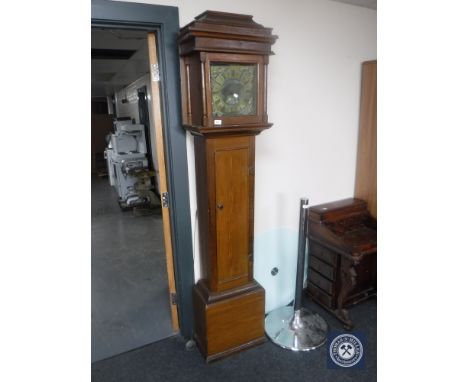 A stained pine longcase clock with brass dial signed Ralph Weston, with pendulum only  CONDITION REPORT: 10" dial. The clock 