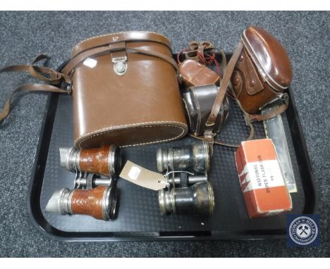 A tray of cased Linderman 10 x 50 binoculars, cased Diax Ib camera with accessories, mouth organ, two pairs of opera glasses 