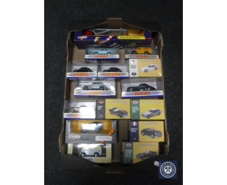 A box of boxed die cast vehicles including Corgi Volvo car transporter, Morris Minor van, classic cars, sports cars etc  