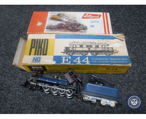 A box boxed Lilliput HO scale engine and wagon, a boxed Piquot E44 wagon and a Piquot steam engine with wagon 