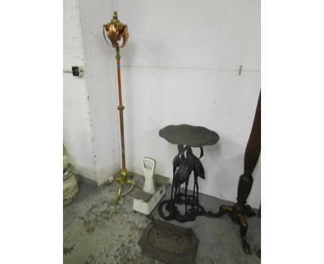 A late Victorian copper and lacquered brass, floor standing oil lamp converted to electricity, a cast iron Victorian foot scr