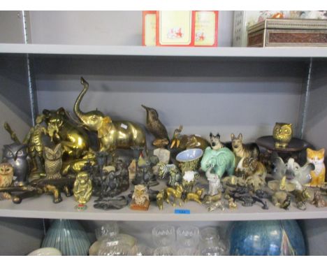 A collection of model animals to include a Dux elephant, brass cats and dogs, and others 