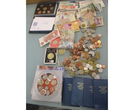 Mixed worldwide banknotes and coins, four Britain's First Decimal Coin packs, proof sets, and a British ten-shillings note Lo