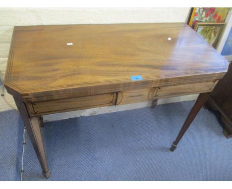 A Regency mahogany fold over card table, standing on tapering legs, 28 1/2"h x 35"w 