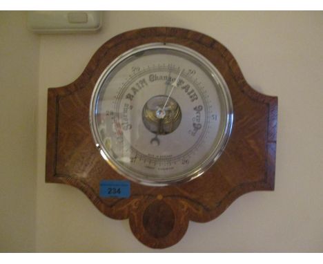 An early 20th century oak Android  Barometer 