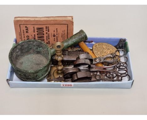 A small group of works of art,&nbsp;to include a Georgian brass candlestick, 12cm high; and four similar steel wick trimmers.
