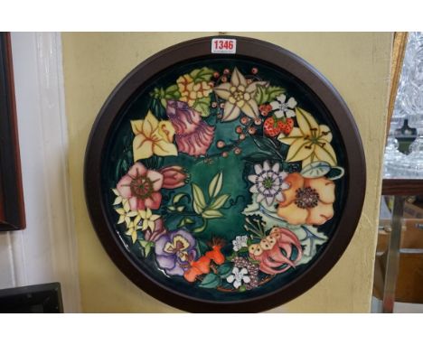 A Moorcroft charger,&nbsp;by R J Bishop, 35cm diameter. 