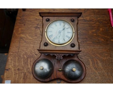 A Continental walnut postman's alarm wall clock, 29cm high. 