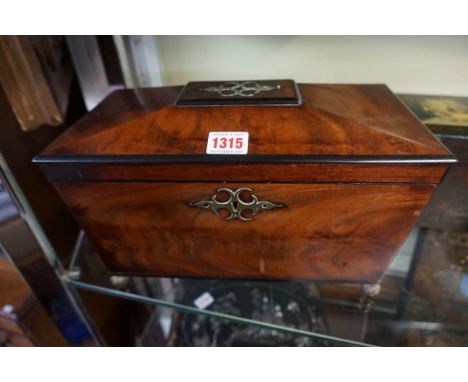A Regency mahogany and brass inlaid sarcophagus tea caddy,&nbsp;32.5cm wide.&nbsp; 