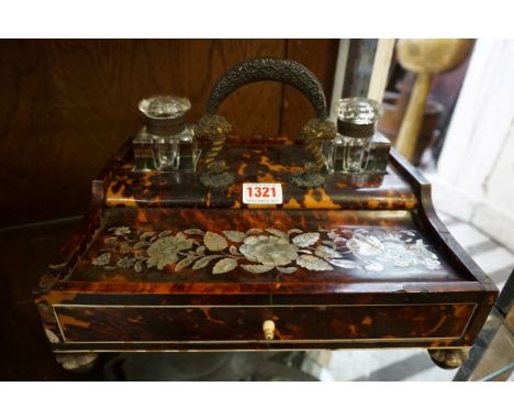 An early Victorian tortoiseshell and mother of pearl desk stand,&nbsp;27cm wide.&nbsp; 