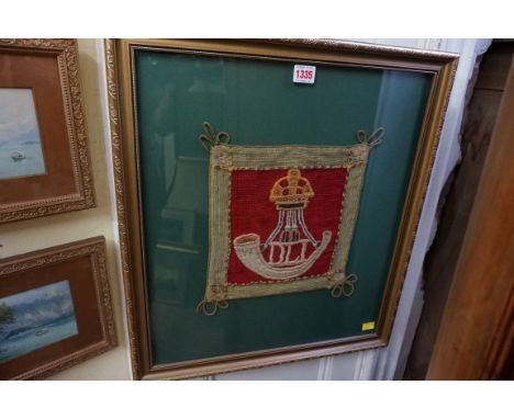 An embroidered 'Durham Light Infantry' regimental crest,&nbsp;approx 26.5 x 25cm, framed and glazed.&nbsp; 