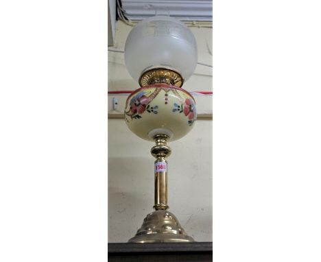 A brass oil lamp,&nbsp;height including shade, 60.5cm.&nbsp; 