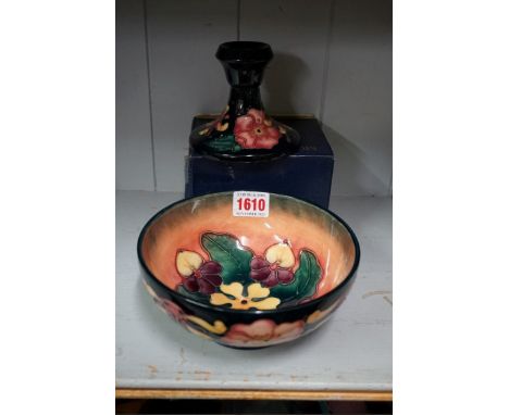 A Moorcroft Oberon pattern bowl, 16cm diameter; and a Moorcroft candlestick, 9cm high, boxed.