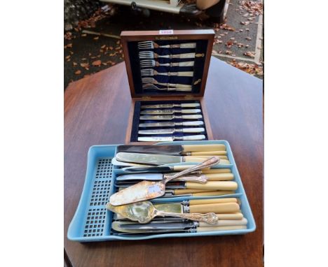 A cased set of six EPNS mother of pearl handled tea knives and forks; together with a small quantity of cutlery. 