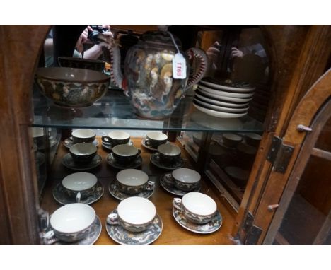 A Japanese satsuma pottery part tea service. 