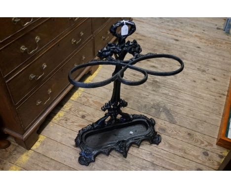 A cast iron stick stand and liner,&nbsp;69.5cm high. 