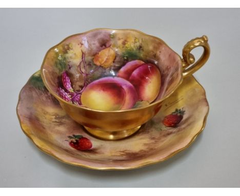 A Royal Worcester fruit painted cabinet cup and saucer,&nbsp;circa 1926, the cup painted by H G Moseley, the saucer by E Town