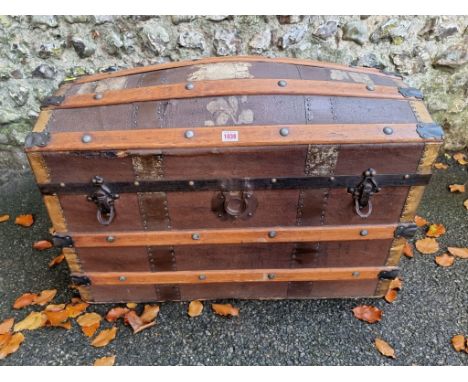 A vintage wood bound dome topped trunk.&nbsp; 