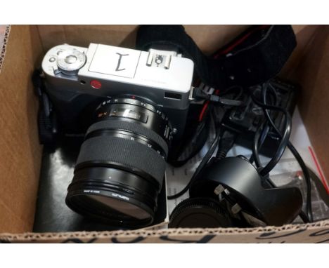 A Leica Digilux 3 digital camera,&nbsp;with instructions and related.&nbsp; 