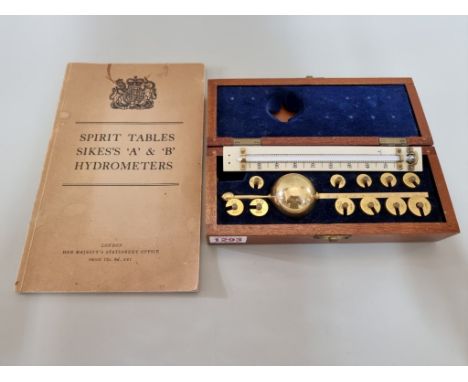 A mahogany cased hydrometer,&nbsp;with ivorine thermometer and&nbsp;booklet of tables. 