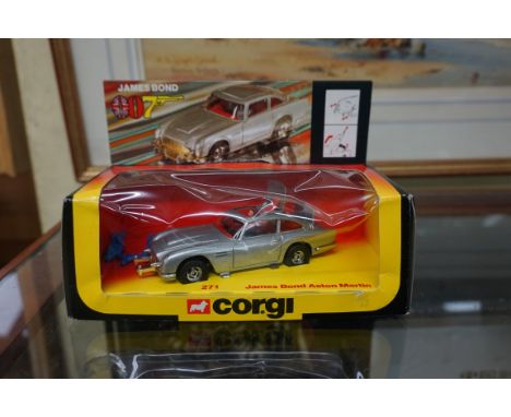 Corgi: a boxed James Bond Aston Martin No.271, with red interior and three figures (two on plastic sprue). 