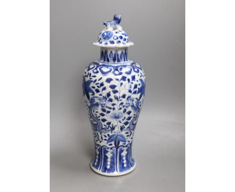 A Chinese blue and white 'dragon' vase and cover, Kangxi mark but 19th century. 33cm