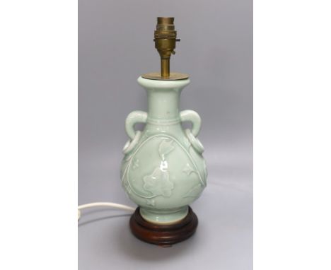 A Chinese celadon glazed two handled table lamp