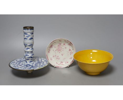 Three Chinese ceramics, including a yellow bowl with inscription to base, 7cm tall, blue and white dragon pattern candlestick