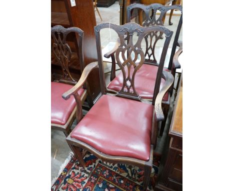 A set of eight Chippendale revival mahogany dining chairs with pierced splats, two with arms
