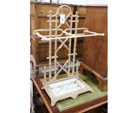 A Victorian style painted metal faux bamboo stick stand, width 52cm, height 70cm