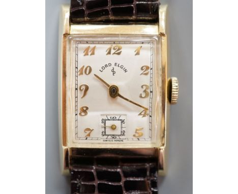 A gentleman's 1950's 14ct Lord Elgin manual wind wrist watch, with angular glass, Arabic dial and subsidiary seconds, on late