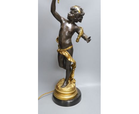 A gilt and brown patinated spelter  putto lamp with flame glass shade, signed Moreau