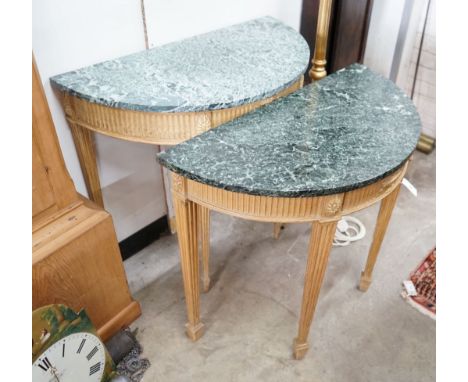 A near pair of reproduction pine marble topped D shaped console tables, larger width 83cm, depth 43cm, height 79cm
