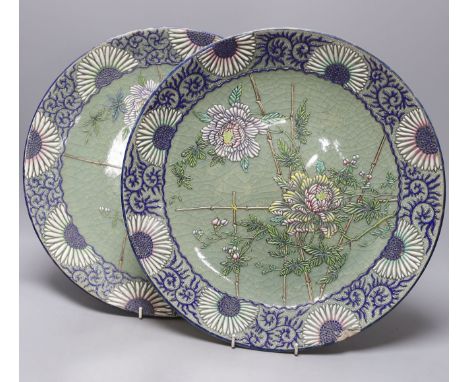 A pair of Japanese pottery moriage celadon ground dishes, early 20th century, 38cm