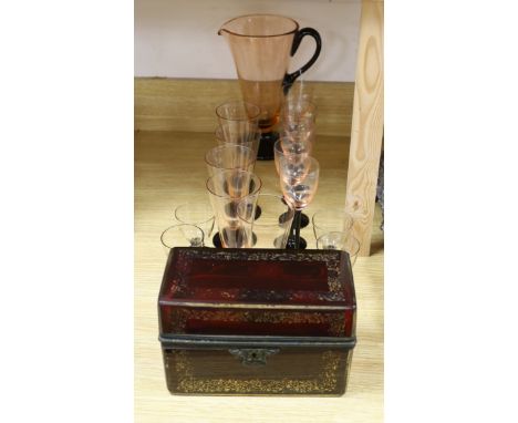 A Bohemian ruby glass casket and an Art Deco style part lemonade set in black and pink glass (14 glasses and a jug)