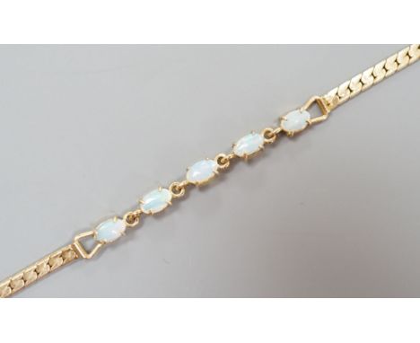 A modern gilt metal and five stone oval white opal set bracelet, 16.5cm.