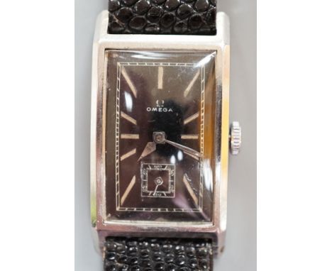 A gentleman's late 1930's stainless steel Omega rectangular black dial manual wind wrist watch, with subsidiary seconds, case