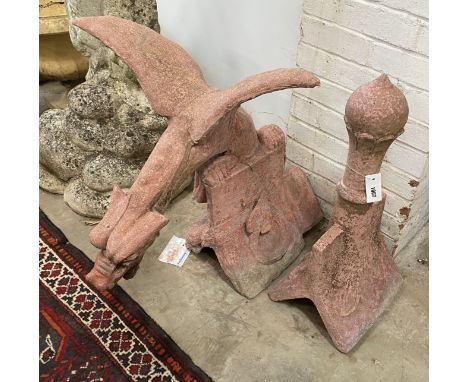 A painted reconstituted stone gargoyle hip tile together with a ball finial hip tile, largest height 69cm