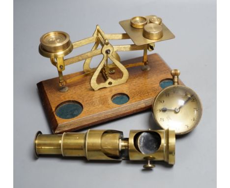 A student's brass monocular microscope, a pair of letter scales and a desk watch,Letter scales 17cms wide.