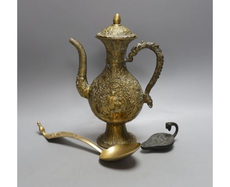 A cast Eastern ewer, 26.5cm tall, together with a miniature cast iron oil lamp and a server spoon (3)