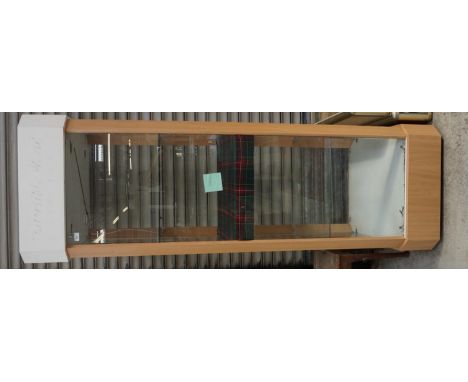 TALL GLAZED DISPLAY CABINET
with light fitments to upper and middle sections, glazed shelving and central tartan covered shel